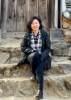 Psychotherapist Hoa My Nguyen, LCSW, seated in a casual outdoor setting